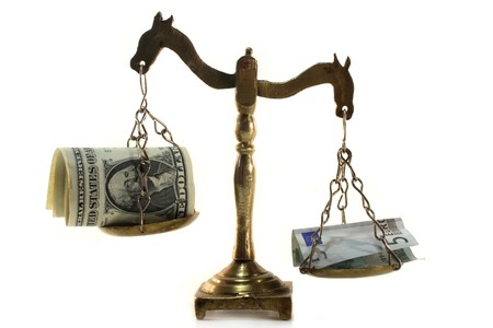 a balance with dollars and eurosの写真素材