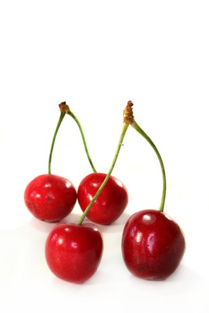 red cherries against white backgroundの写真素材