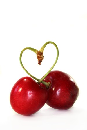 red cherries against white backgroundの写真素材