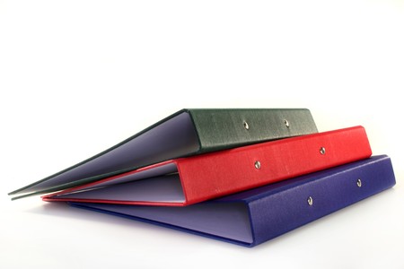 three colored folders on a white background