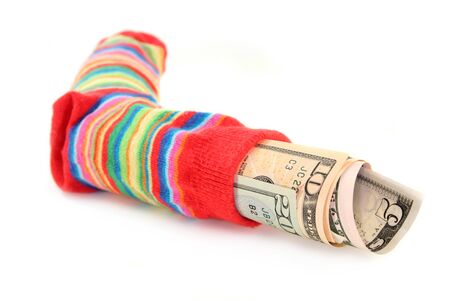 a colorful stockings, stuffed with dollar billsの写真素材
