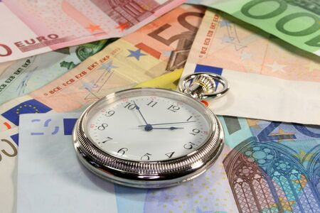 Pocket Watch and many euro notes superimposed