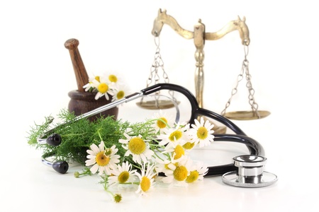 Stethoscope on a white background and chamomile
の写真素材