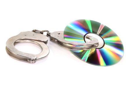 a blank CD with handcuffs on white backgroundの写真素材