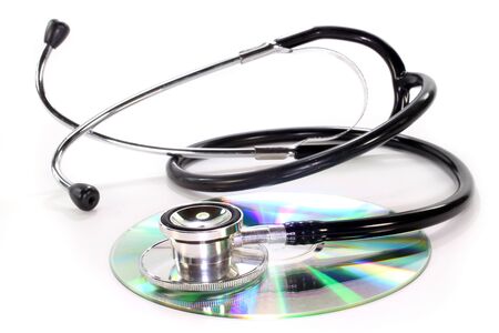 Cd and stethoscope on a white backgroundの写真素材