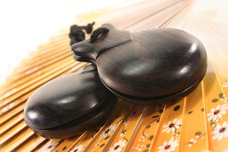 two castanets on a Spanish fanの写真素材