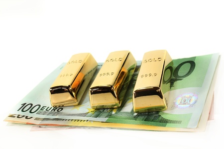 Gold bars and Euro notes on a light backgroundの写真素材