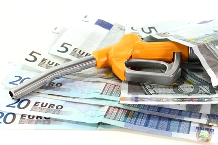 fuel nozzle and euro notes on a white backgroundの写真素材