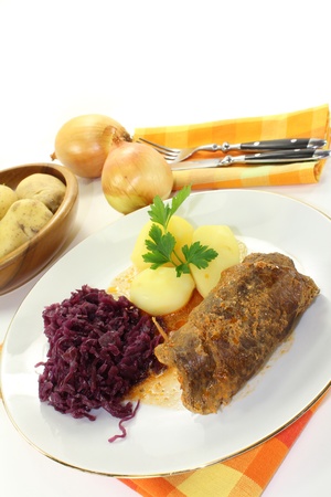 braised beef roll with potatoes and red cabbageの写真素材