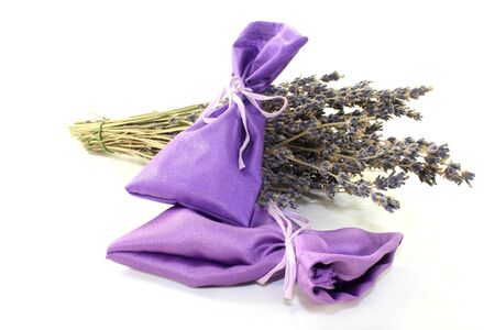 dried lavender flowers and lavender bags against white backgroundの写真素材