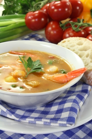 a bowl of bouillabaisse with shrimp and musselsの写真素材