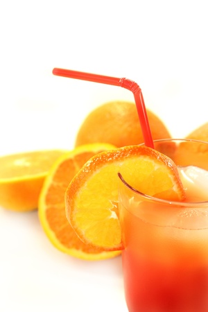a glass of Campari orange and ice cubesの写真素材