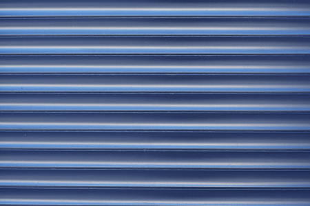 Surface textured horizontal, striped, blue facing wall, sidingの写真素材