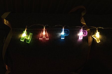 Glowing Lighting Letter Happyの写真素材