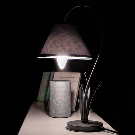 Vintage Iron Shade Lamp in dark Environment Close-up Viewの写真素材