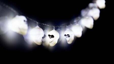 White glowing blurred skull Halloween fairy lightsの写真素材