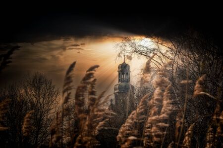 Church cloth in a gloomy setting mood and a dark skyの写真素材