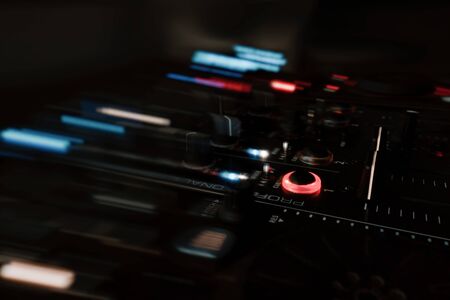 A night shot of a DJ mixed with wiping effects and colored lightsの写真素材
