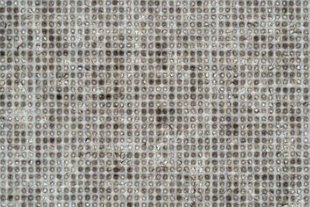 Macro shot of fine brown beige fabric in a square shapeの写真素材