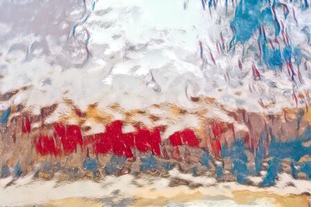 A white, red, blue colored glass paneの写真素材