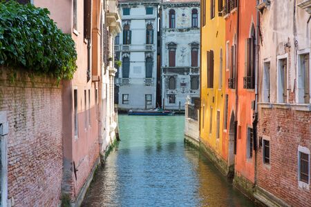 A row of houses on the canal in the middle of Veniceの写真素材