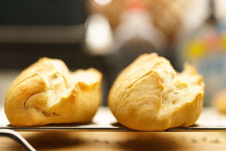 Fresh baguette bread sticks from the oven on a grate, close-upの写真素材