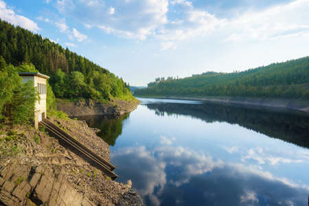 Panorama view of a dam in Germany in summer with blue skyの写真素材
