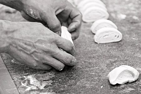Baker making breadの写真素材