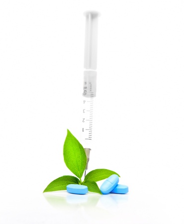Concept of alternative medicine with a plant and pillsの写真素材