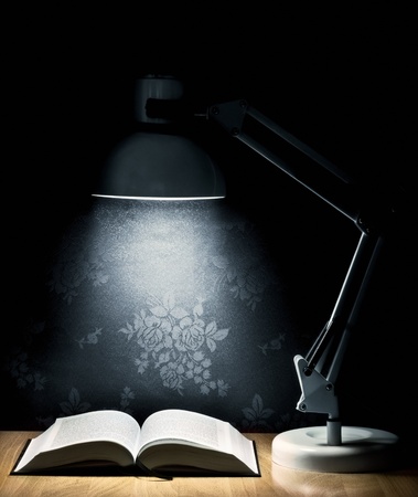 Lamp that illuminates an open bookの写真素材