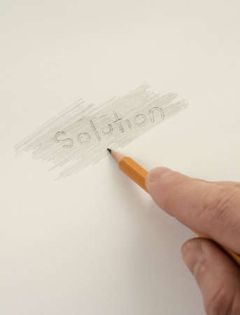 Businessman searching hidden solutions on paperの写真素材