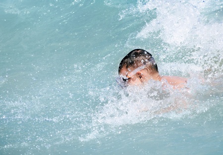Young boy swimming in the seaの写真素材
