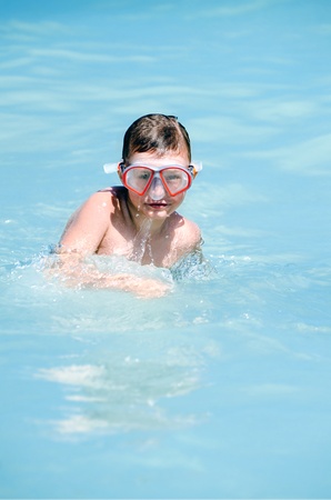 Young boy diving in the waterの写真素材