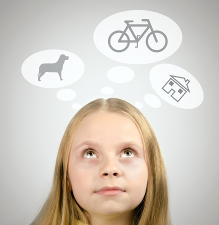 Close-up portrait of a beautiful child  looking up の写真素材