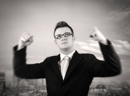 Businessman showing  his victory.Motion blur to his handsの写真素材