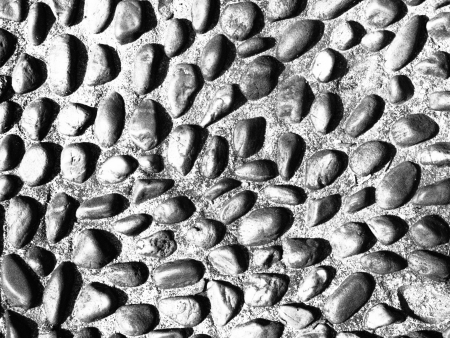 black and white image of surface of round stone floor
