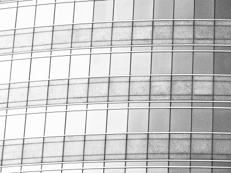 black and white image of pattern modern glass building