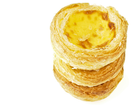 triple stack tower of delicious eggtart on white 