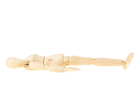 pose of wood manikin sleeping on white backgroundの写真素材