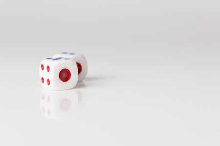 pair of dice show one point side on white backgroundの写真素材