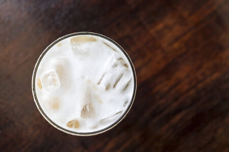 top view of cold cappuccino on wood table