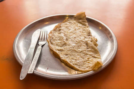 dish of omelet in stainless plate in india style