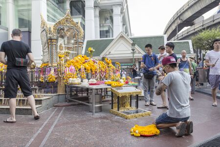 BANGKOK,THAILAND - APR 17 : Unidentified tourist pray to Erawan shrine at Ratchaprasong Junction on april 17, 2016, Thailand. Erawan shrine is one of famously sacred item in Ratchaprasong areaのeditorial素材