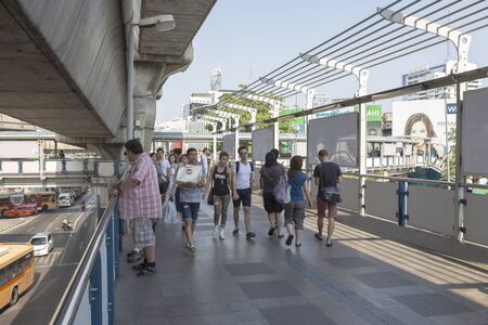 BANGKOK THAILAND - APR 24 : tourist walking on skywalk over Pathum Wan Junction near MBK center on april, 24, 2016, thailand. this skywalk link between BTS National Stadium station and Siam squareのeditorial素材