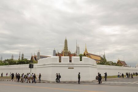 BANGKOK THAILAND - NOV 13 : people on corner of wat phra kaew at Ratchadamnoen Nai road in sanam luang area, while the funeral of king Bhumibol Adulyadej in Grand Palace on november, 13, 2016のeditorial素材
