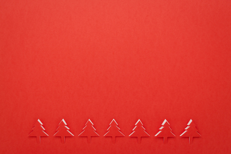 Christmas red background with below Christmas tree border lineの写真素材