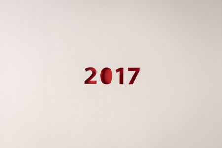 red 2017 numbers cutting design on white texture paperの写真素材