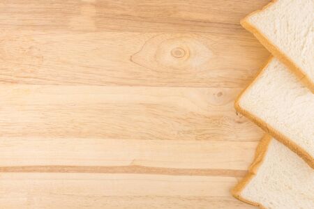 one side rin decoration by slide bread on wooden background