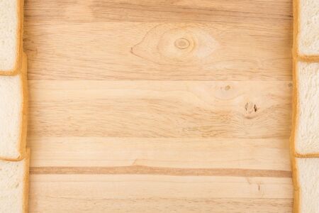 idea of border design at short side by slide bread on wooden backgroundの写真素材