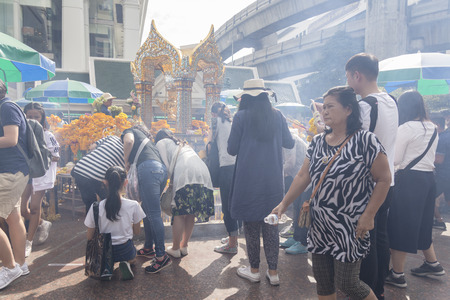 BANGKOK,THAILAND - DEC 31 : incense smoke scene from people worship in Erawan shrine while new year festival on december 31, 2016, Thailand. Erawan shrine is famously place in ratchaprasong areaのeditorial素材
